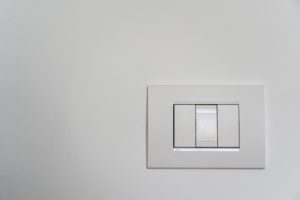 White Light Switch on White Painted Wall